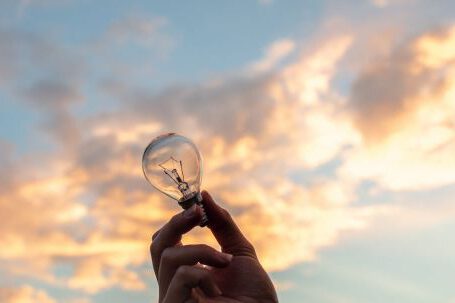 Innovation - Person Holding Clear Light Bulb