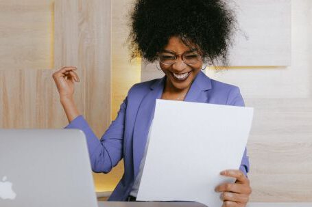 Business Success - Woman Holding A Paper