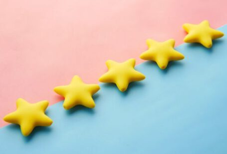 Feedback - a row of yellow stars sitting on top of a blue and pink surface