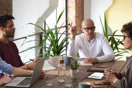 Business Meeting - Man Wearing White Long-sleeved Shirt Holding Black Pen