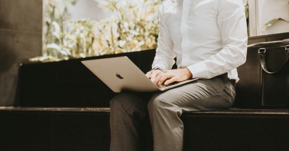 Business - Man in Shirt Working on Laptop